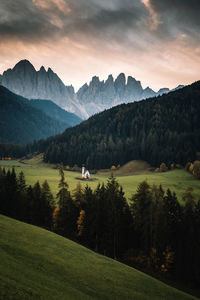 Scenic view of landscape and mountains against sky