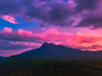 Scenic view of mountains against dramatic sky