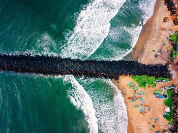 Aerial view of stone pier at beach