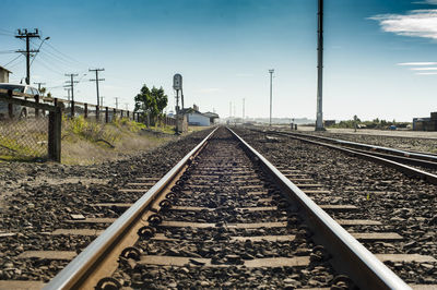 Surface level of railroad tracks against clear sky