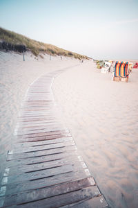 Footpath leading towards beach during winter