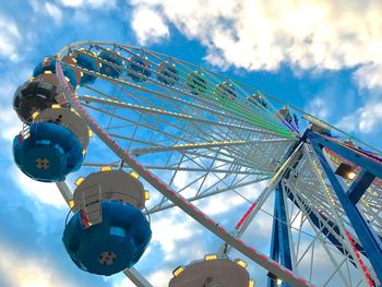 Low angle view of ferris wheel against sky