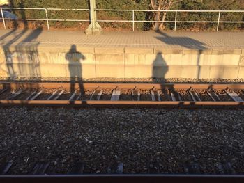 Men walking on railroad track