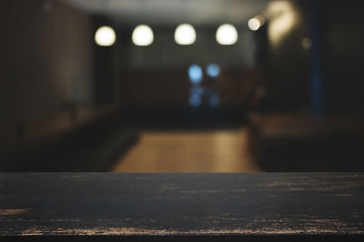 Defocused image of illuminated lights on table