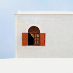 Low angle view of window on wall of building