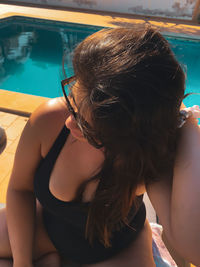 High angle view of young woman in car