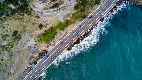 High angle view of highway amidst trees in city