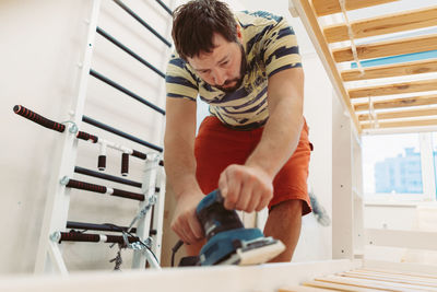 High angle view of man working in gym