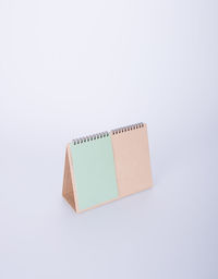 High angle view of desk calendar on white background