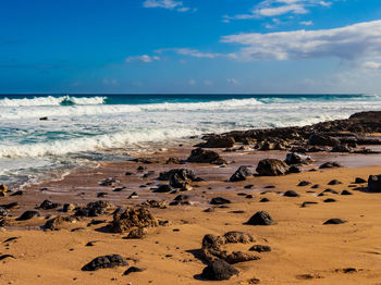 Scenic view of beach against sky