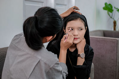 Side view of young woman looking away