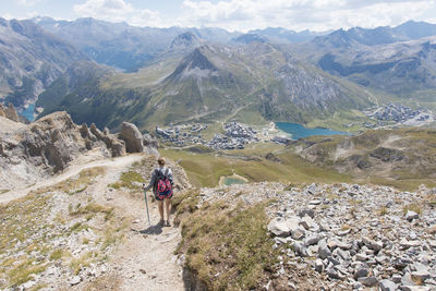 Rear view of man walking on mountain