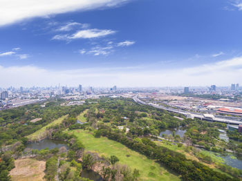 Cityscape against cloudy sky