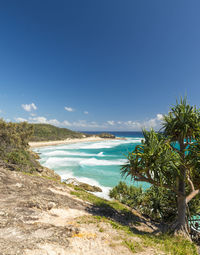 Scenic view of sea against blue sky