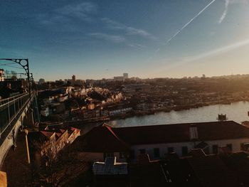 High angle view of buildings in town against sky