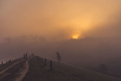 Scenic view of landscape against sky during sunset