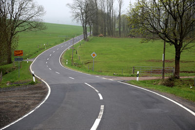 Empty road along landscape