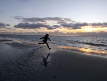 Scenic view of sea at sunset