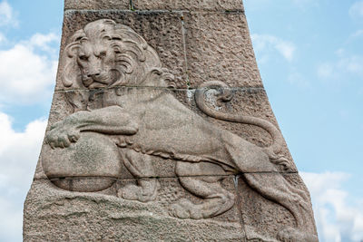 Low angle view of statue against sky