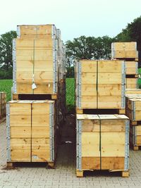 View of wooden poles on field against sky