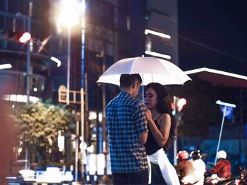 Young couple standing in city