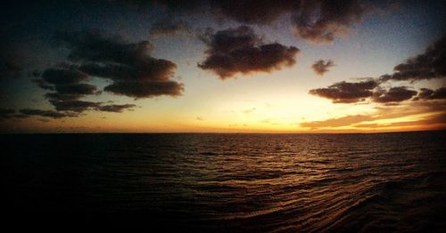 Scenic view of sea at sunset