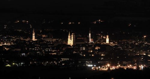High angle view of illuminated buildings in city at night