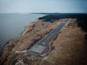 High angle view of road by sea against sky