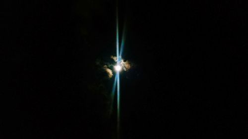 Low angle view of illuminated sky at night