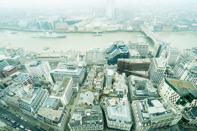 High angle view of river amidst buildings in city