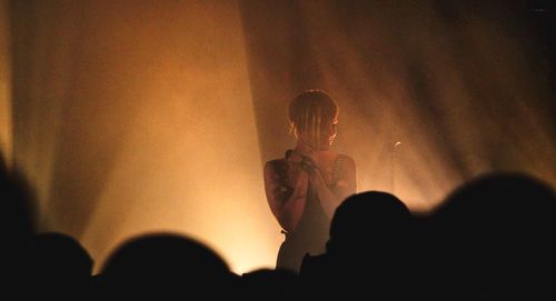 Silhouette people at music concert