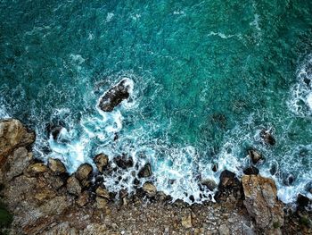 High angle view of rocks in sea