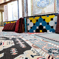 Multi colored umbrellas on tiled floor at home