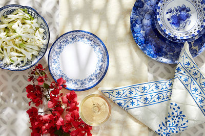 Festival abstract creative shoot with the collection of plates, napkins and flowers