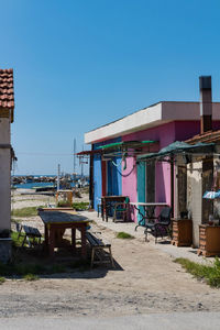 Houses against clear blue sky in city