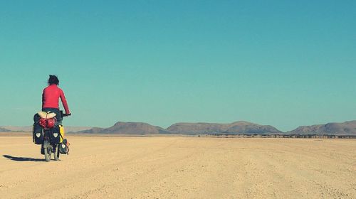 Rear view of man on desert