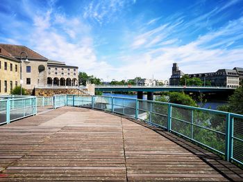 View of bridge over river against buildings