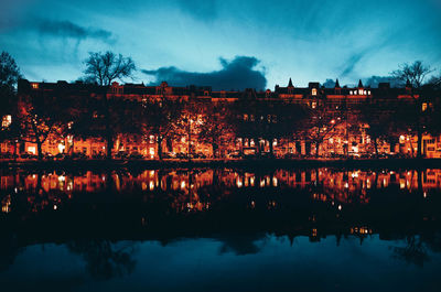 Reflection of river in city at night