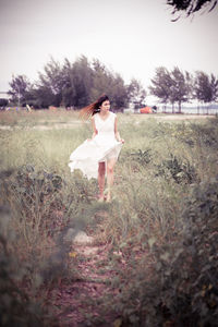 Full length of woman standing on field