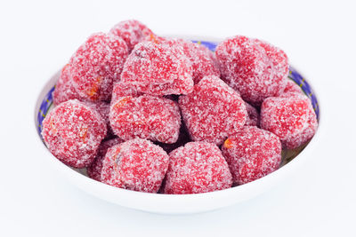 Close-up of strawberries over white background