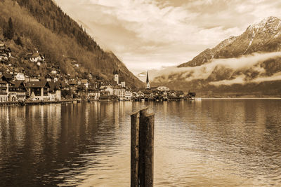 Scenic view of lake by mountain against sky