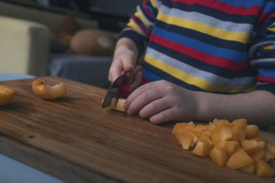 Midsection of man preparing food at home