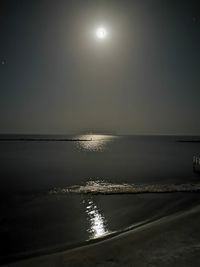 Scenic view of sea against sky at night