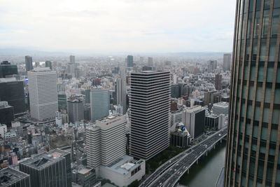 High angle view of buildings in city against sky