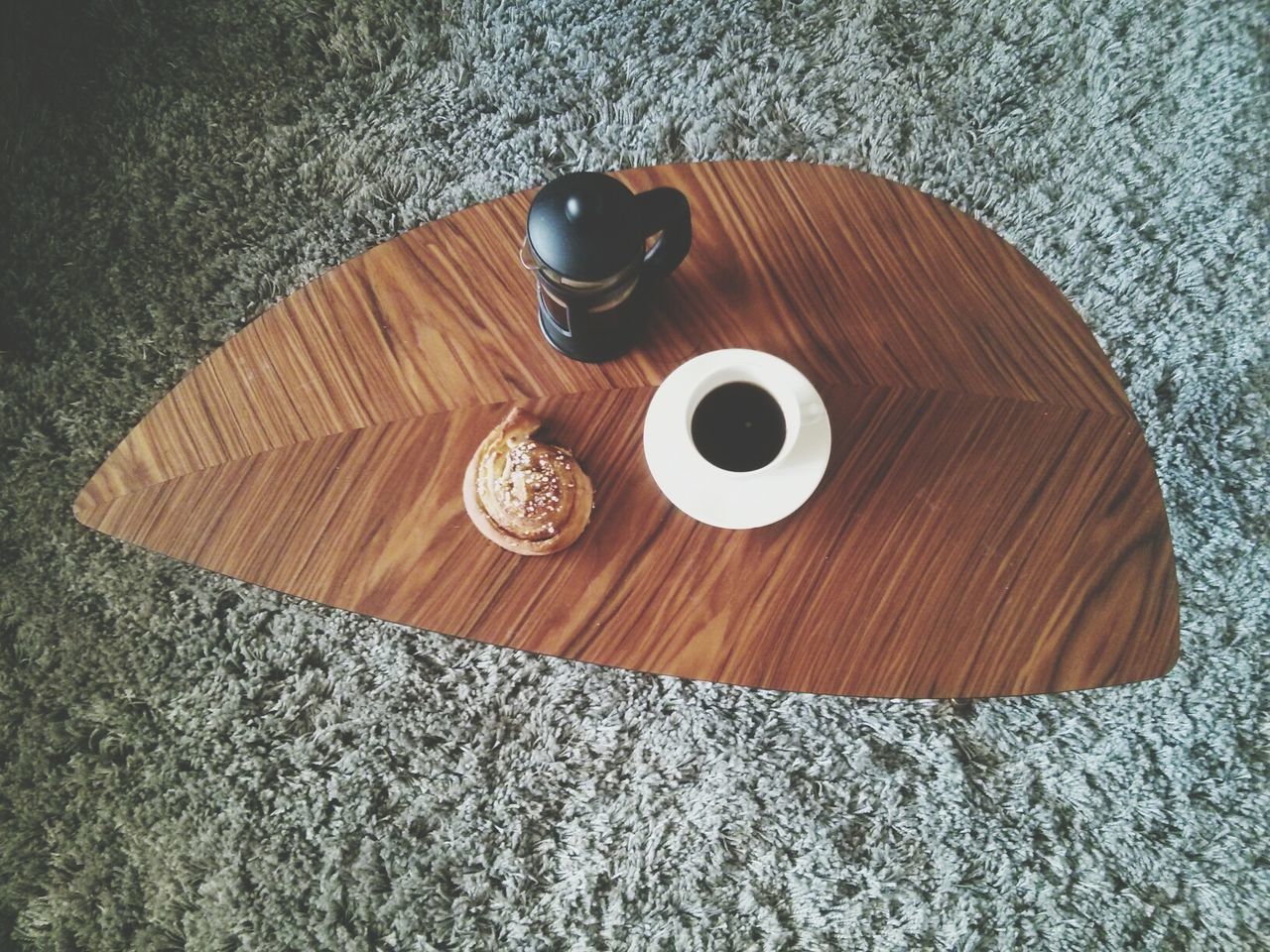 table, food and drink, still life, high angle view, indoors, drink, wood - material, refreshment, directly above, coffee cup, wooden, freshness, coffee - drink, close-up, no people, drinking glass, food, circle, cup, shadow