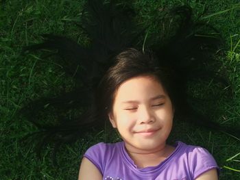 Portrait of young woman in grass