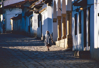 Woman on her way back home, impression of boyacá, columbia, biggest market olace in south america