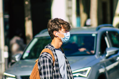 Portrait of young man in car