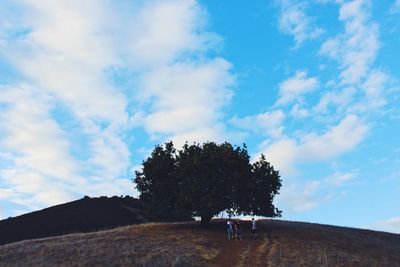 Scenic view of landscape against cloudy sky