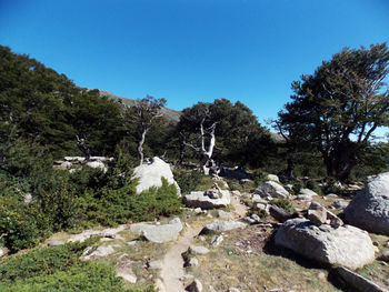 Scenic view of mountains against clear blue sky